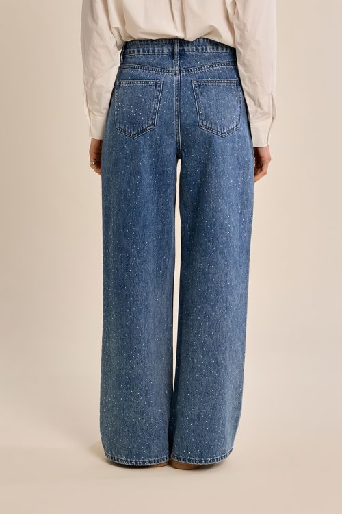 Flared jeans, studded with rhinestones