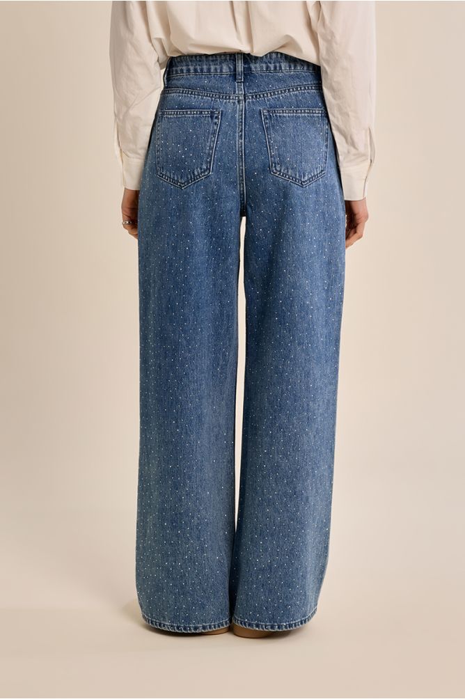 Flared jeans, studded with rhinestones