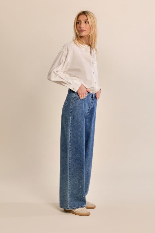 Flared jeans, studded with rhinestones