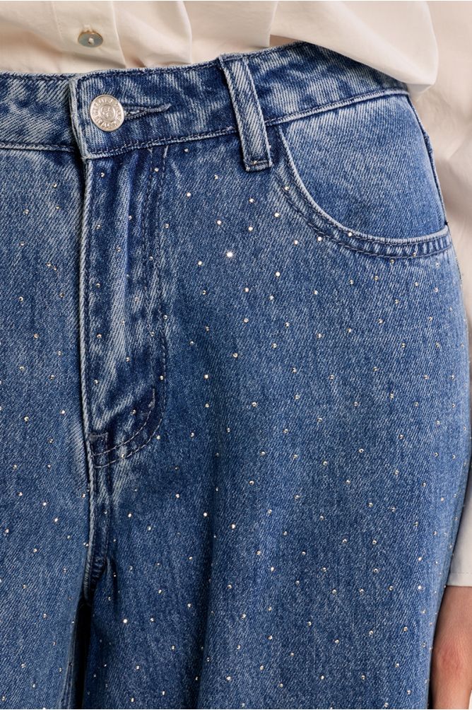 Flared jeans, studded with rhinestones