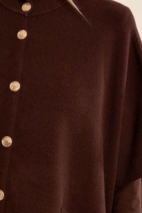 Knitted cape, buttoned