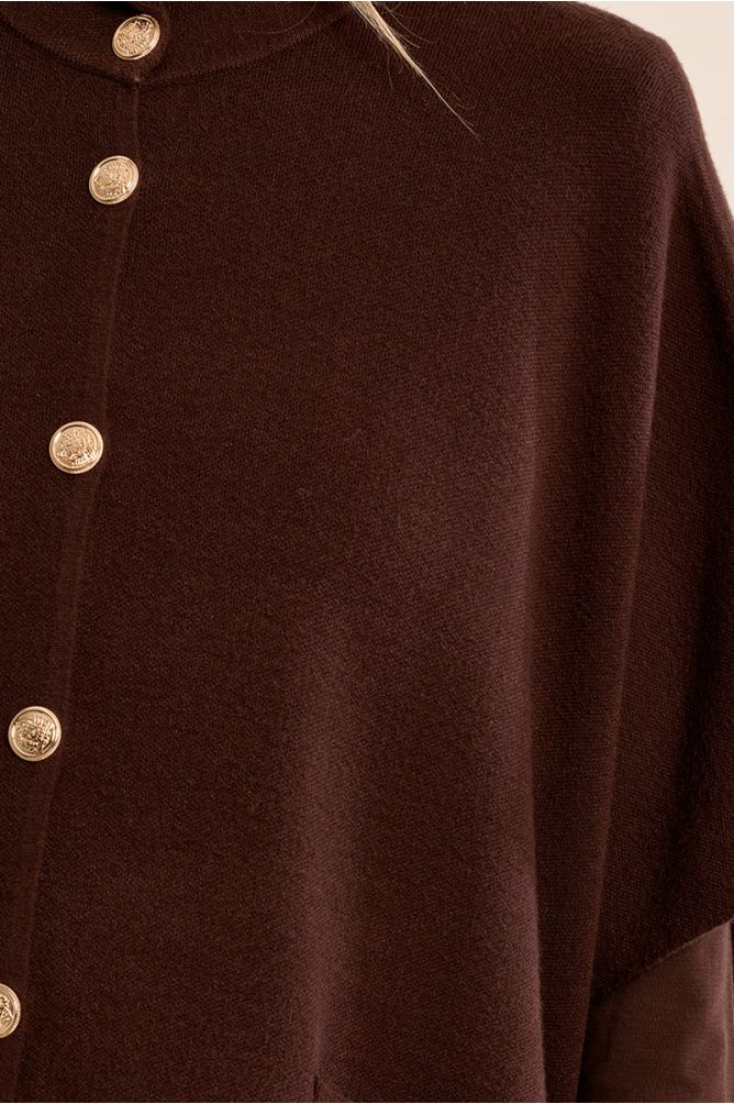 Knitted cape, buttoned
