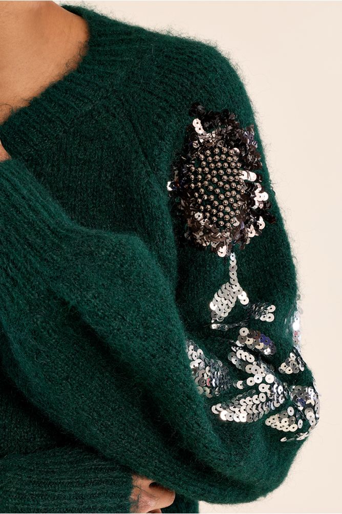 Rhinestone sweater on the sleeves