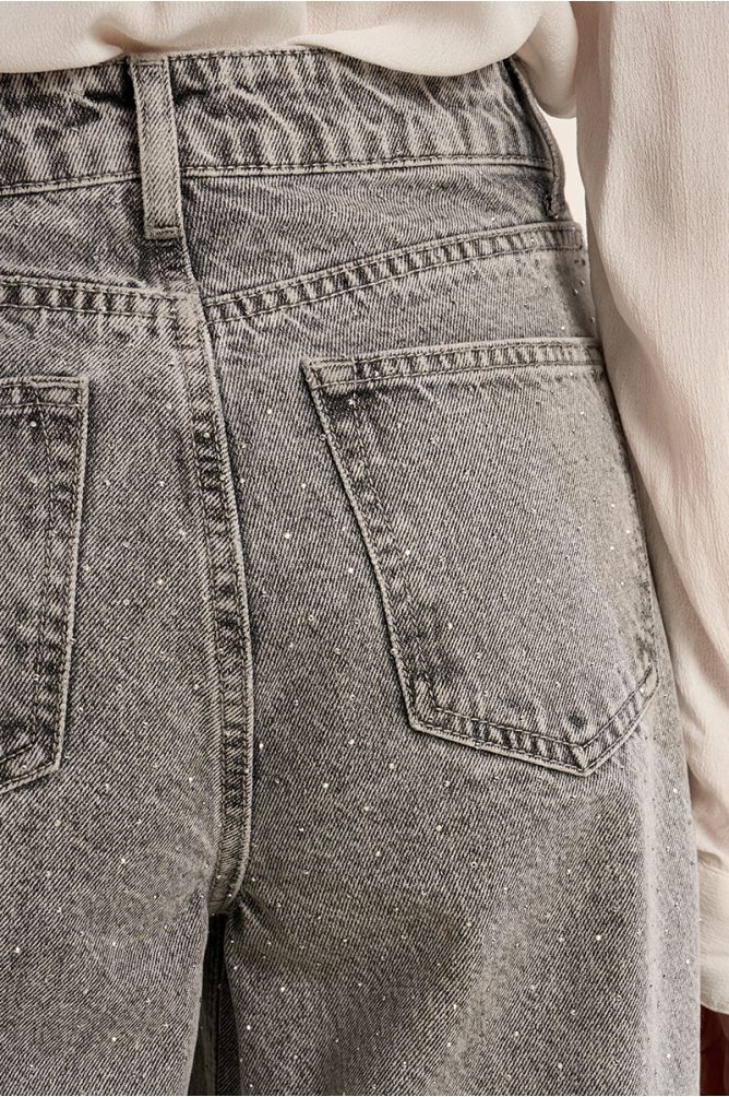 Flared jeans, studded with rhinestones