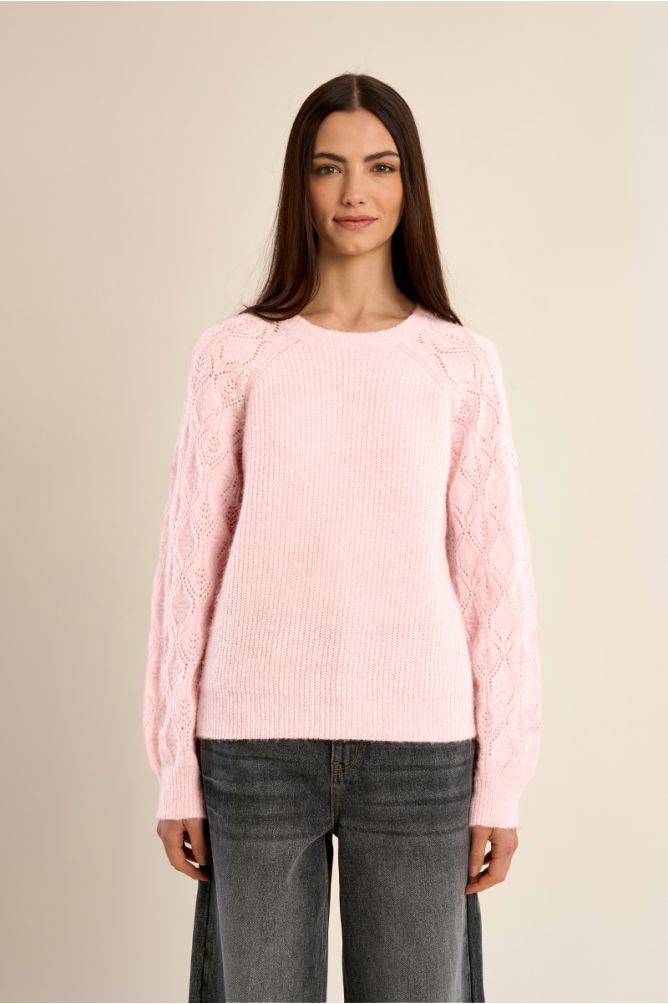 Knitted sweater with openwork sleeves