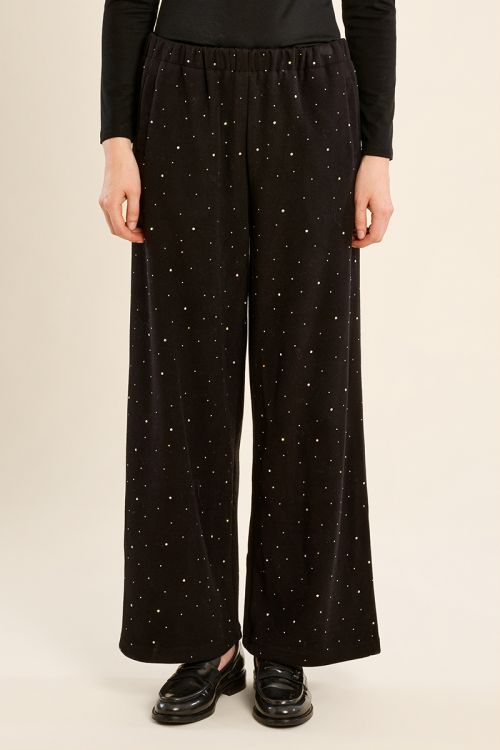 High-waisted trousers, studded with rhinestones