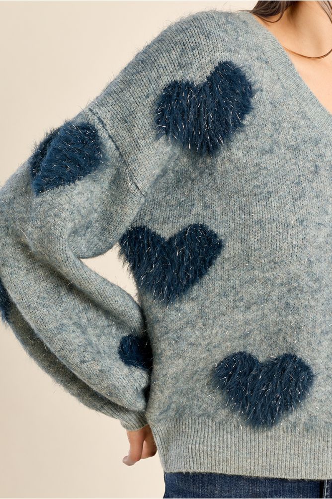 Fluffy sweater with iridescent hearts