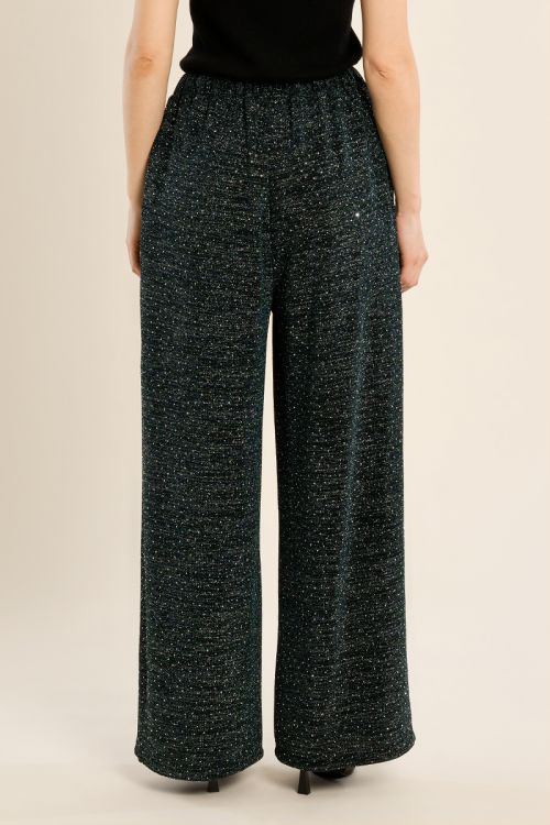 High-waisted trousers, studded with rhinestones
