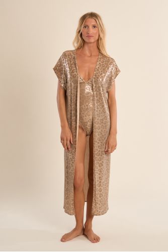 Chaqueta de mujer larga, en tejido brillante, con flecos y estampado.