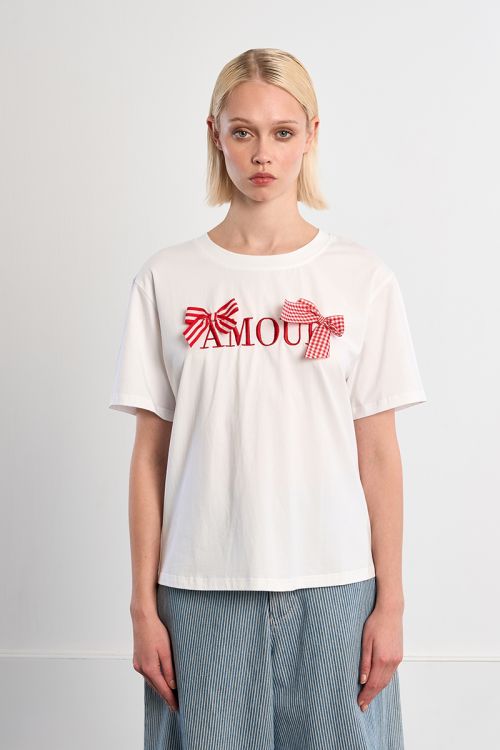 Camiseta de mujer de manga corta, estampado y lazos.