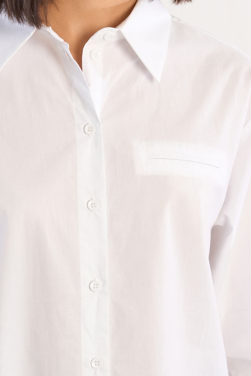 Camisa de mujer de manga larga, bolsillo frontal.