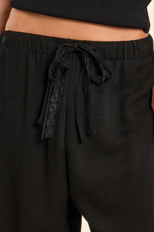 Pantalón de mujer largo, con lazada.