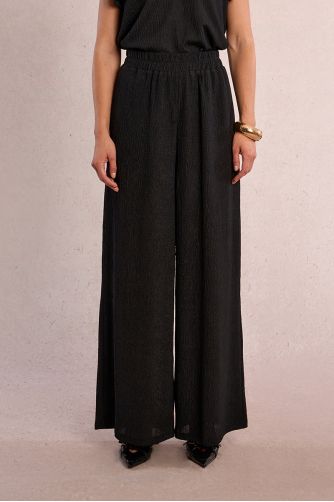 Straight, flowing trousers in semi-sheer