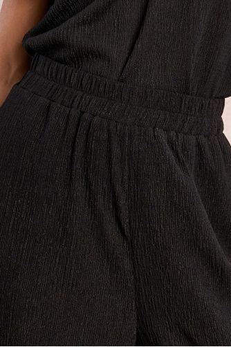 Straight, flowing trousers in semi-sheer