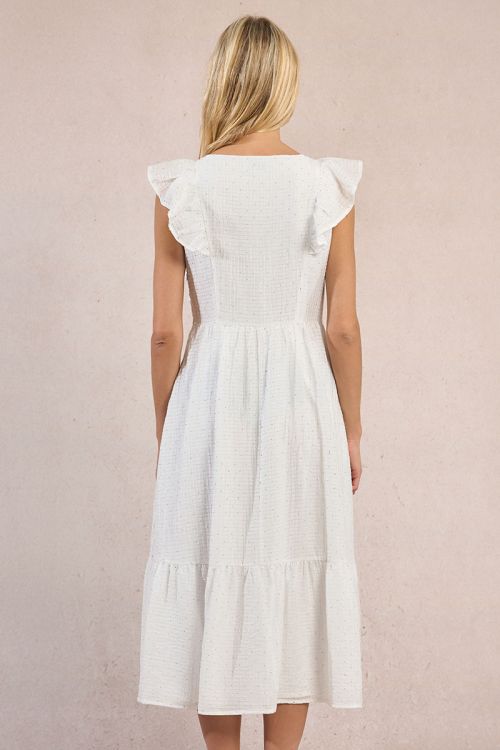 Vestido largo, de manga corta, con volantes y lunares.