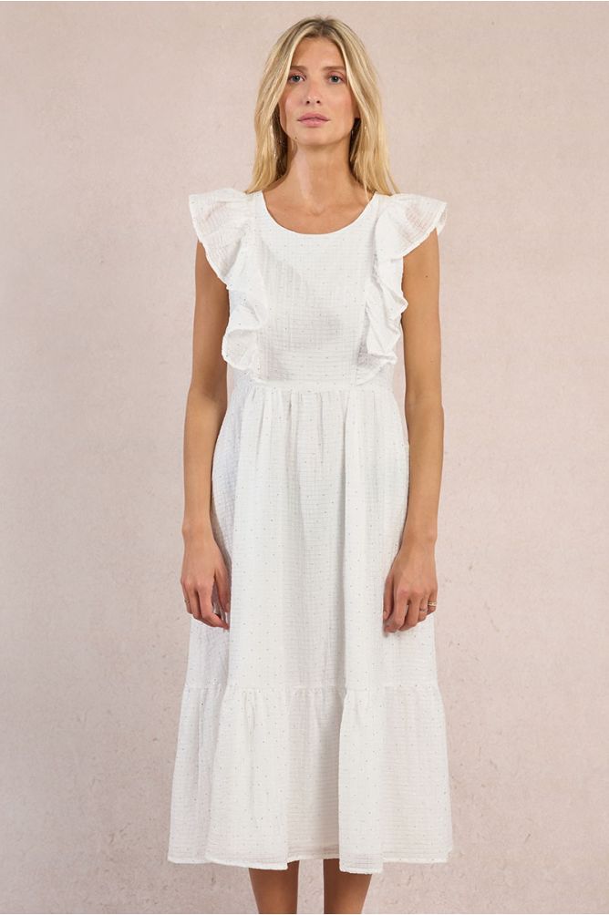 Vestido largo, de manga corta, con volantes y lunares.