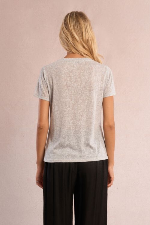Camiseta de mujer de manga corta, tejido brillante.