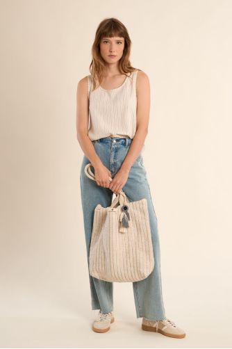 Bolso de mujer de tela, con estampado y borlas.