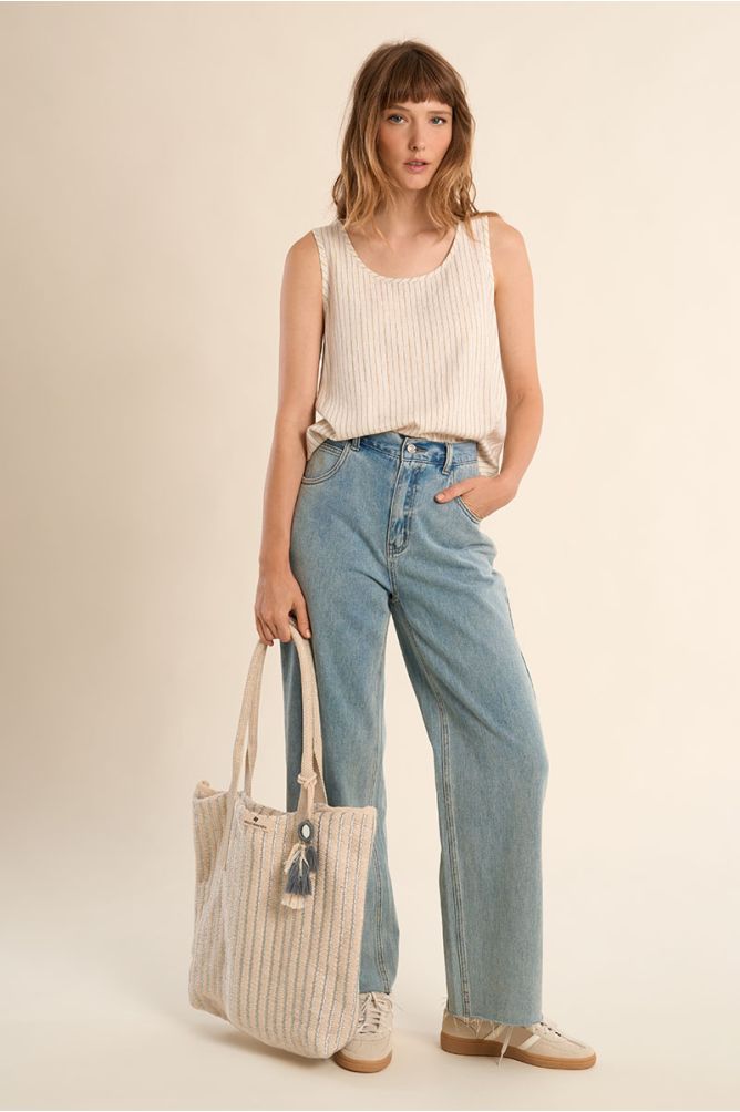 Bolso de mujer de tela, con estampado y borlas.