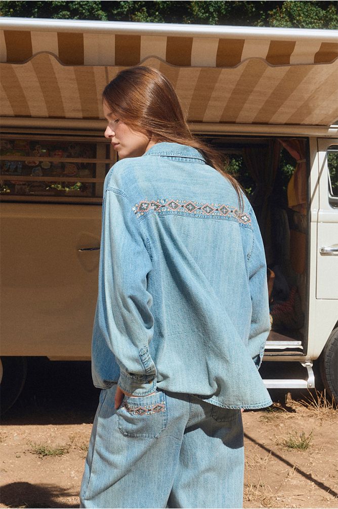 Denim shirt with bead detailing.
