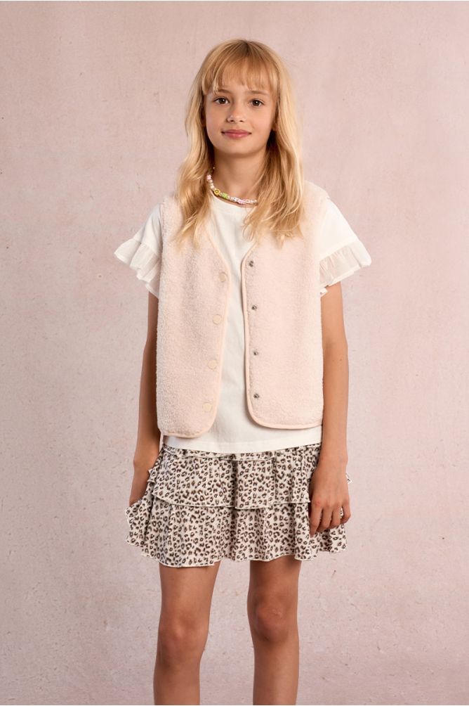 Falda de niña corta, con estampado y volantes.