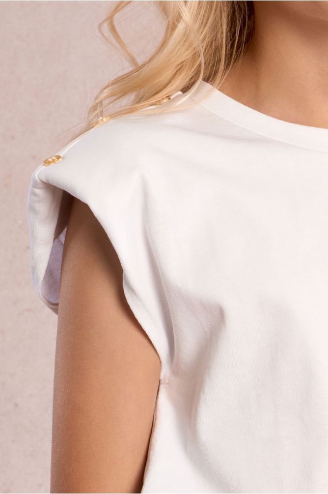 Camiseta de niña de manga corta, detalle botones.