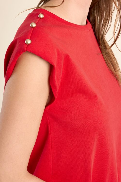 Camiseta de mujer de manga corta, detalle botones.