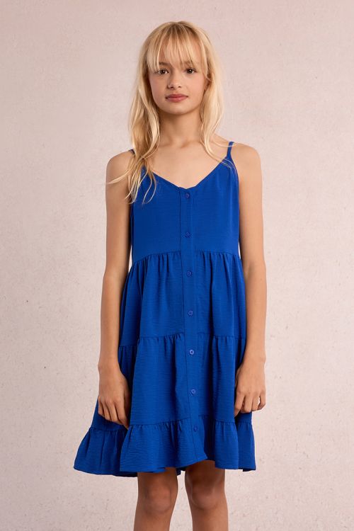 Vestido de niña de tirantes, con volantes y lazada.