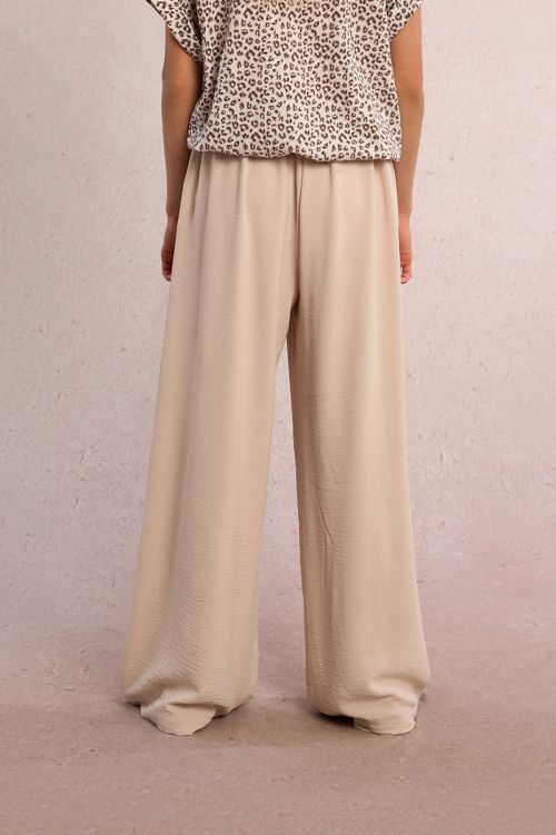 Pantalón de niña largo, con pliegues y lazada.