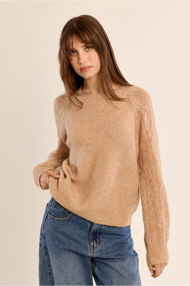 Knitted sweater with openwork sleeves