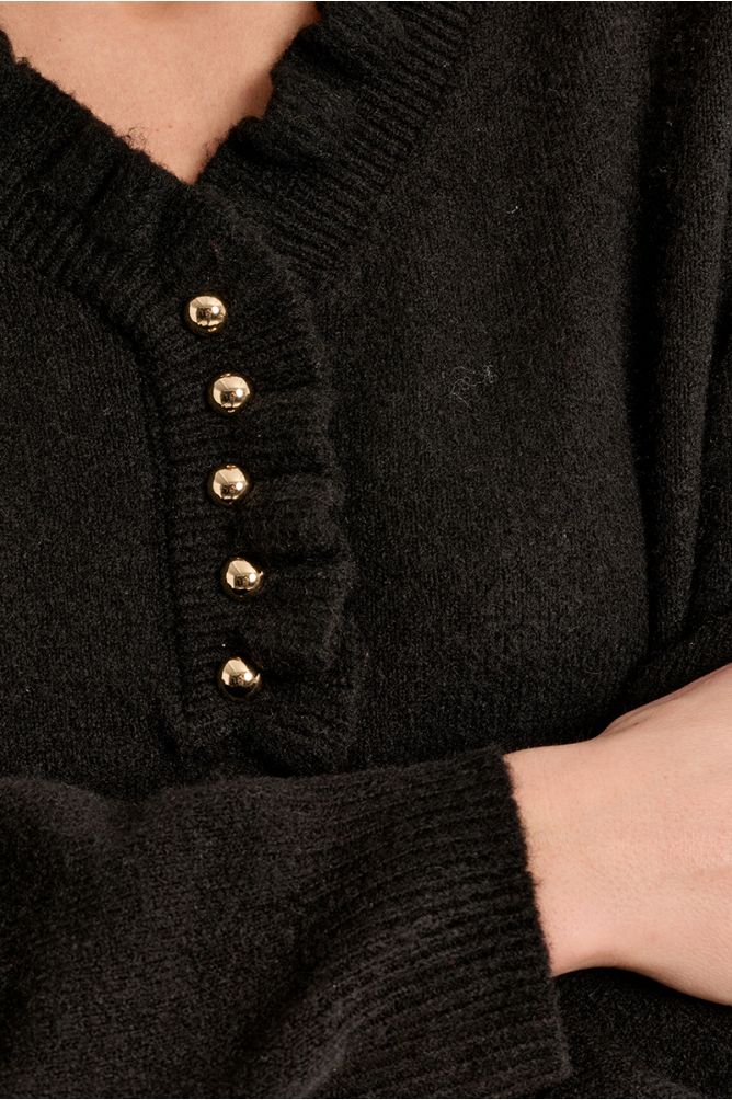 Knitted sweater with ruffled collar
