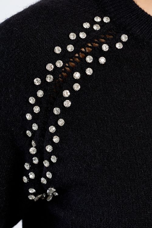 Knitted sweater, openwork embroidery and studs
