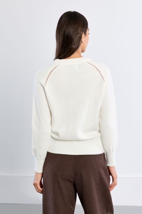 Knitted sweater, openwork embroidery and studs