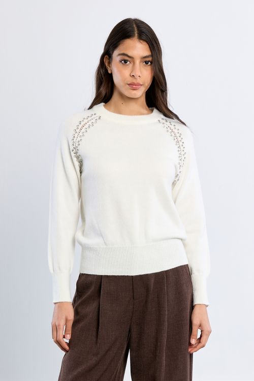 Knitted sweater, openwork embroidery and studs