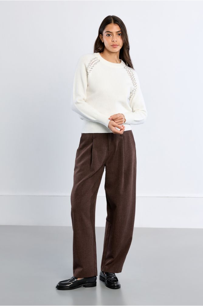 Knitted sweater, openwork embroidery and studs