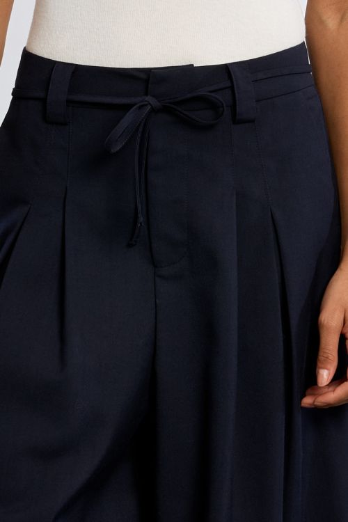 Baggy trousers, pleated