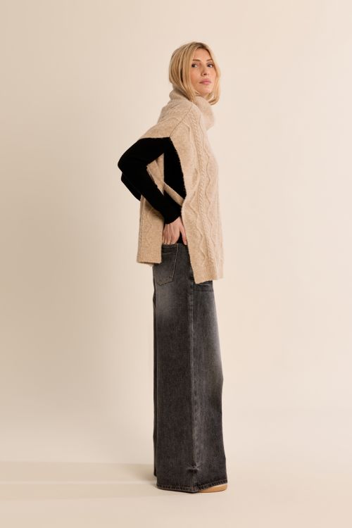 Poncho en maille torsadée