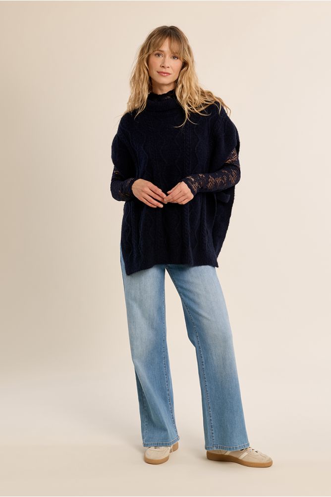 Poncho en maille torsadée
