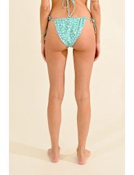 Bikini bottom in printed fabric, fine sliding straps on sides for adjustment.