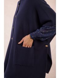 Knitted cape, buttoned