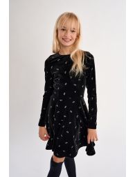 Robe en velours, parsemée de nœuds brillants