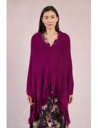 Ponchoasimétrico con flecos en el bajo