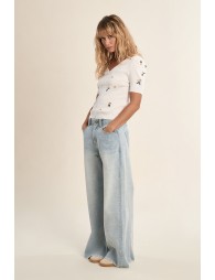 Jersey de mujer de manga corta, detalle flores.