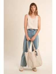 Bolso de mujer de tela, con estampado y borlas.