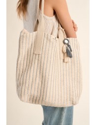 Bolso de mujer de tela, con estampado y borlas.