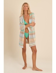 Chaqueta de mujer larga, en tejido brillante, con flecos y estampado.