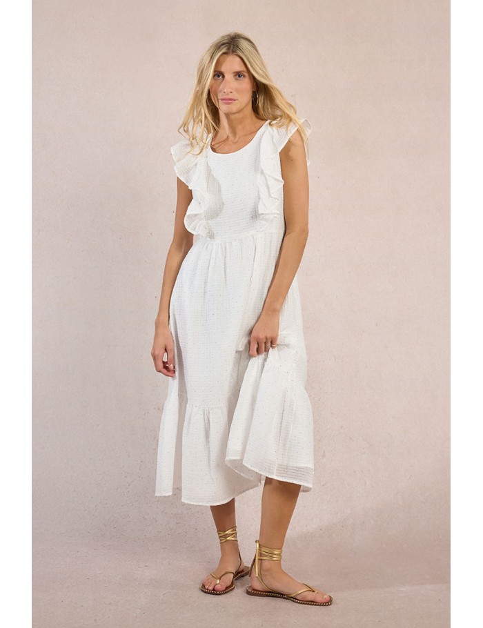 Vestido largo, de manga corta, con volantes y lunares.