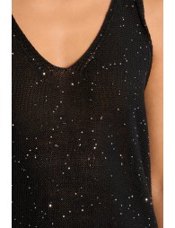 Top de mujer de manga sisa, con lunares brillantes.