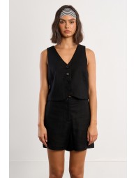 Chaleco de mujer corto, cierre de botones frontal.